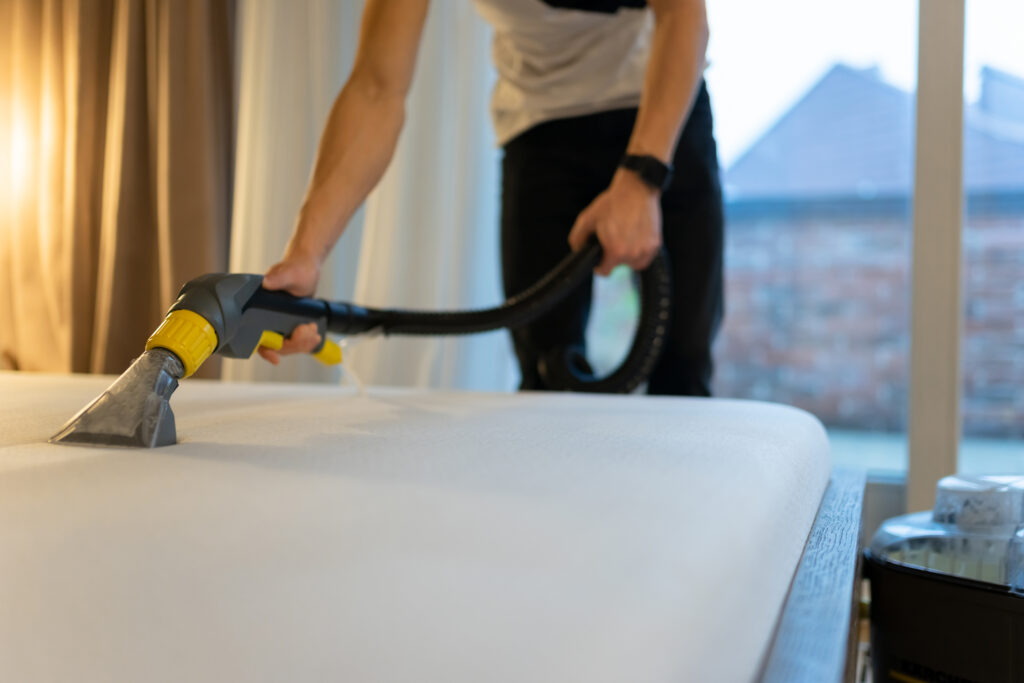 Professional mattress cleaning service Dublin - steam cleaning white mattress with industrial equipment
